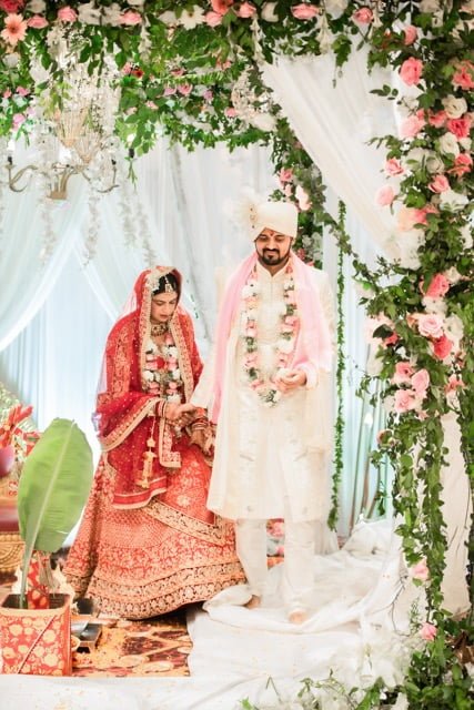 Bride and groom exchanging vows in Lucknow, photographed by expert wedding photographers of Lucknow